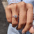 The pave set round engagement ring delivers elegant brilliance.