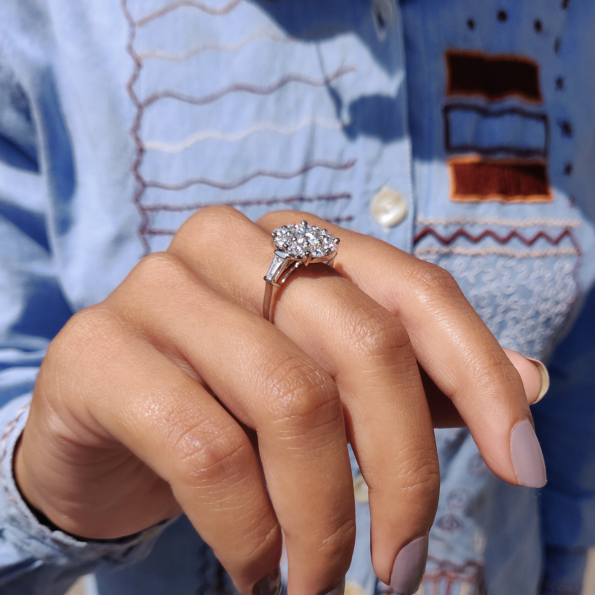 The halo engagement ring enhances the stone with added brilliance.
