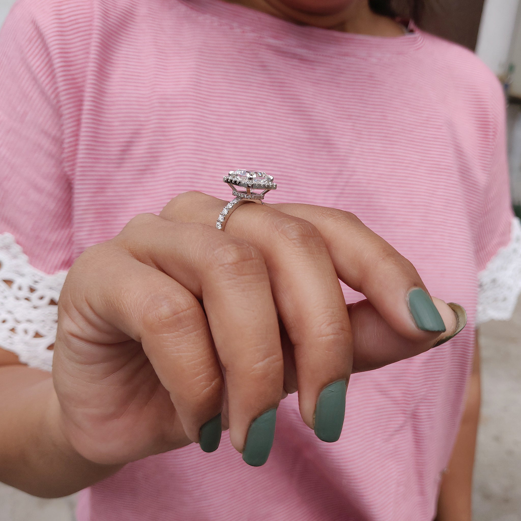 A round cut halo and hidden halo ring creates a layered effect.