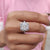 The moissanite halo ring shines with subtle elegance and sparkle.
