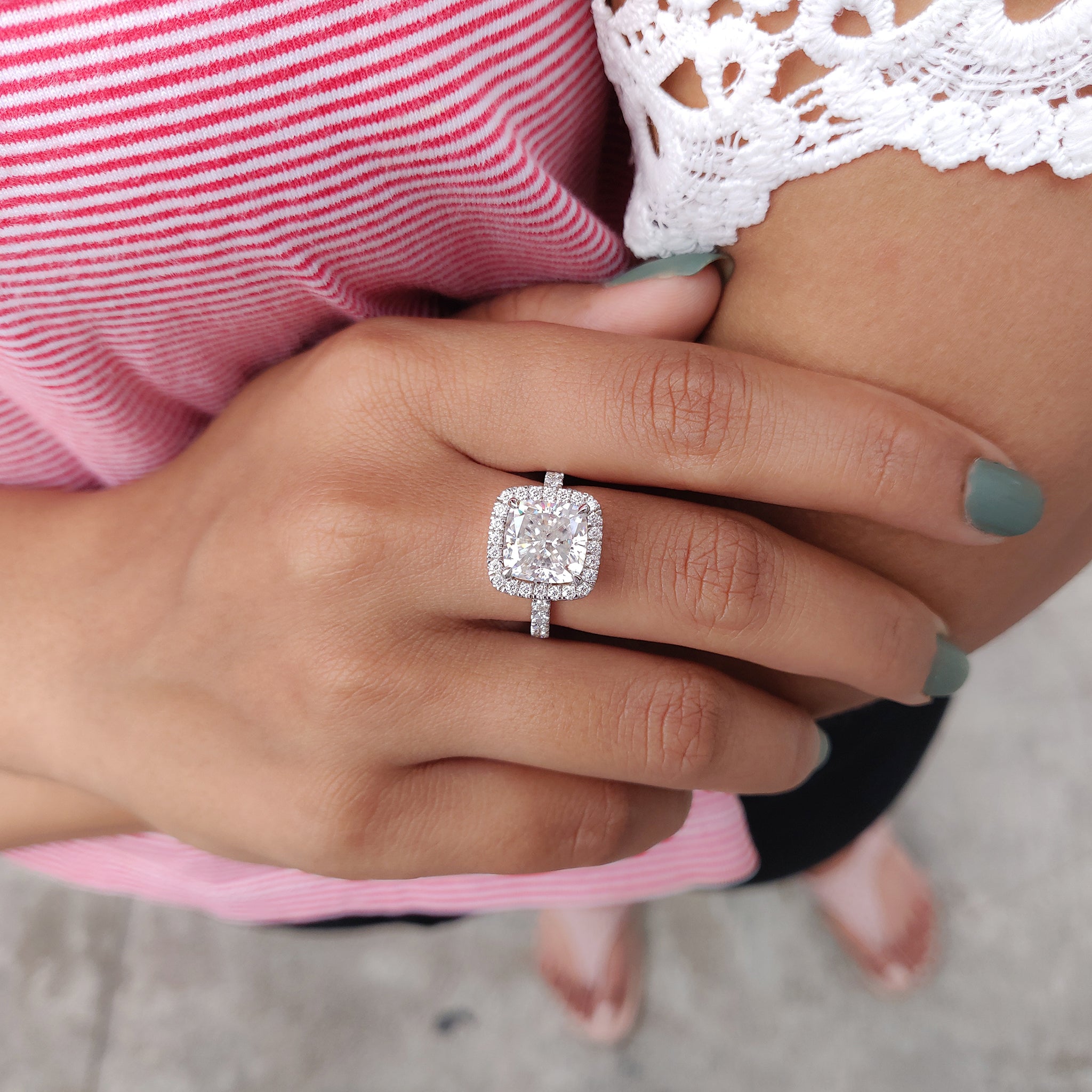 The hidden halo ring setting adds secret sparkle around the stone.
