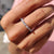Baguette cut wedding band featuring a sleek design with white gold accents.
