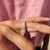 Round Moissanite wedding band crafted with high-quality white gold for a classic look.