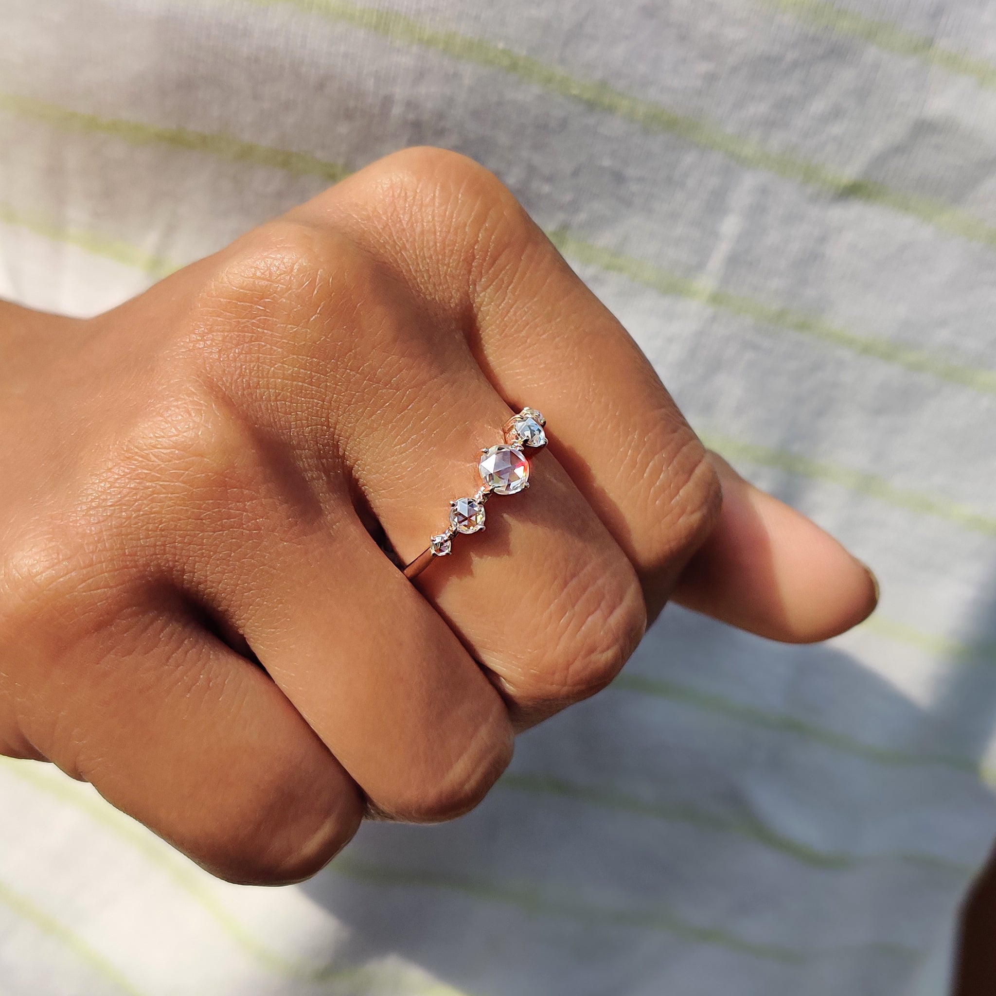 Custom engagement ring with compass setting and fine detailing
