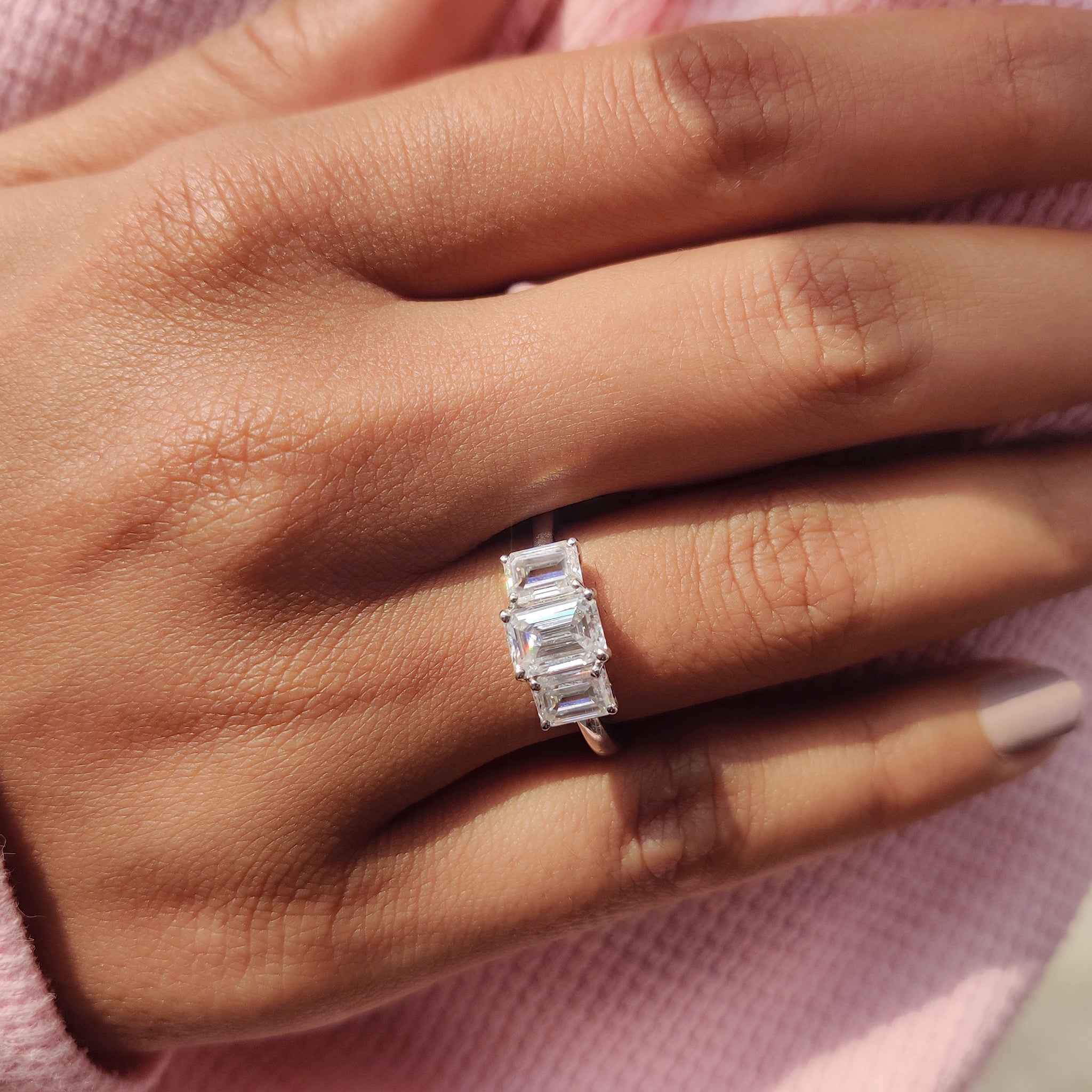 The four prong engagement ring settings securely hold the center stone.
