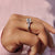 A stunning emerald cut moissanite ring shines with exceptional brilliance.
