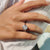 The Portuguese cut ring adds a unique, vintage-inspired style.
