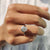 This bezel engagement ring features a sleek and modern design.
