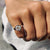 This bezel set solitaire ring offers a sleek, modern design with a secure setting.
