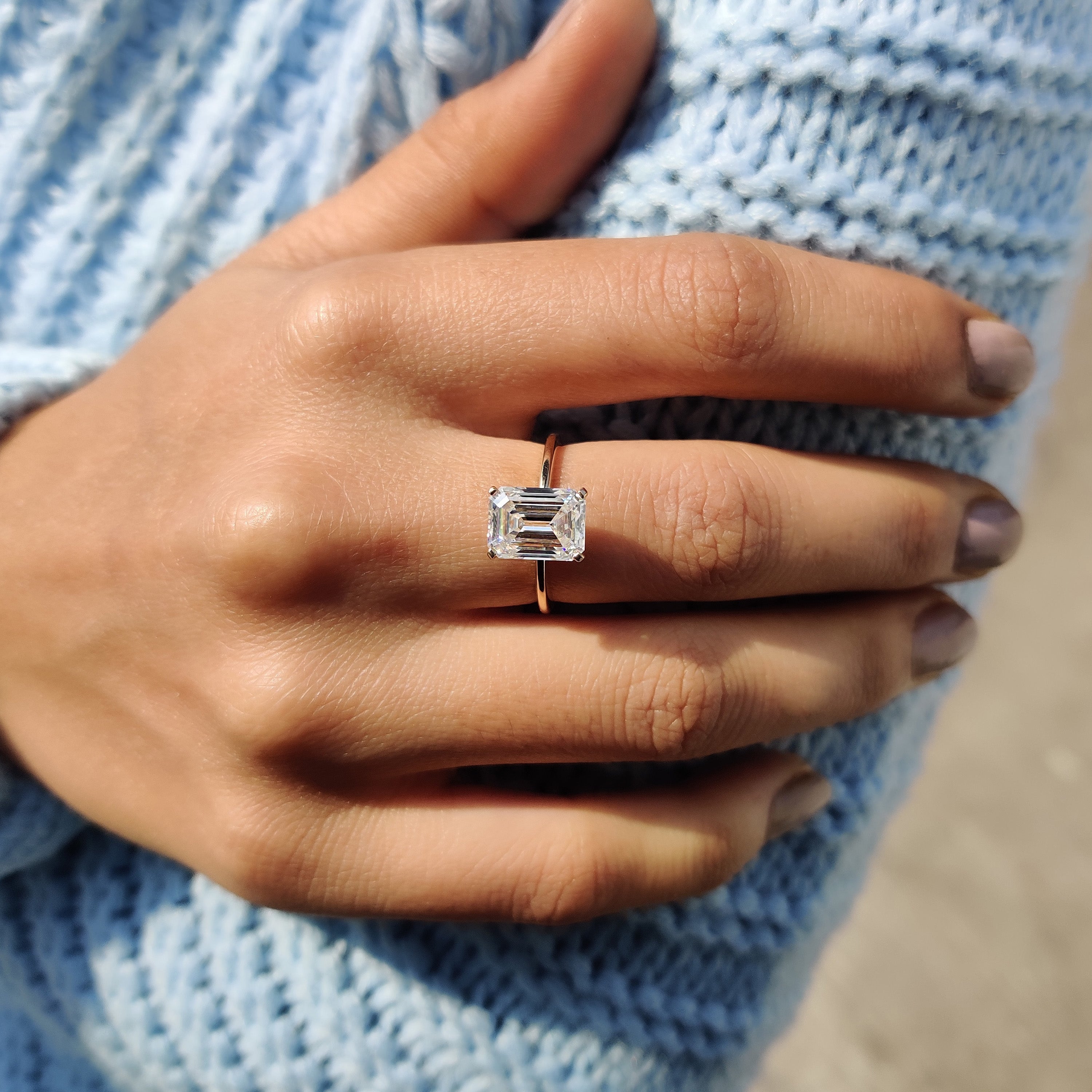 Carat diamonds ring with emerald solitaire stone.
