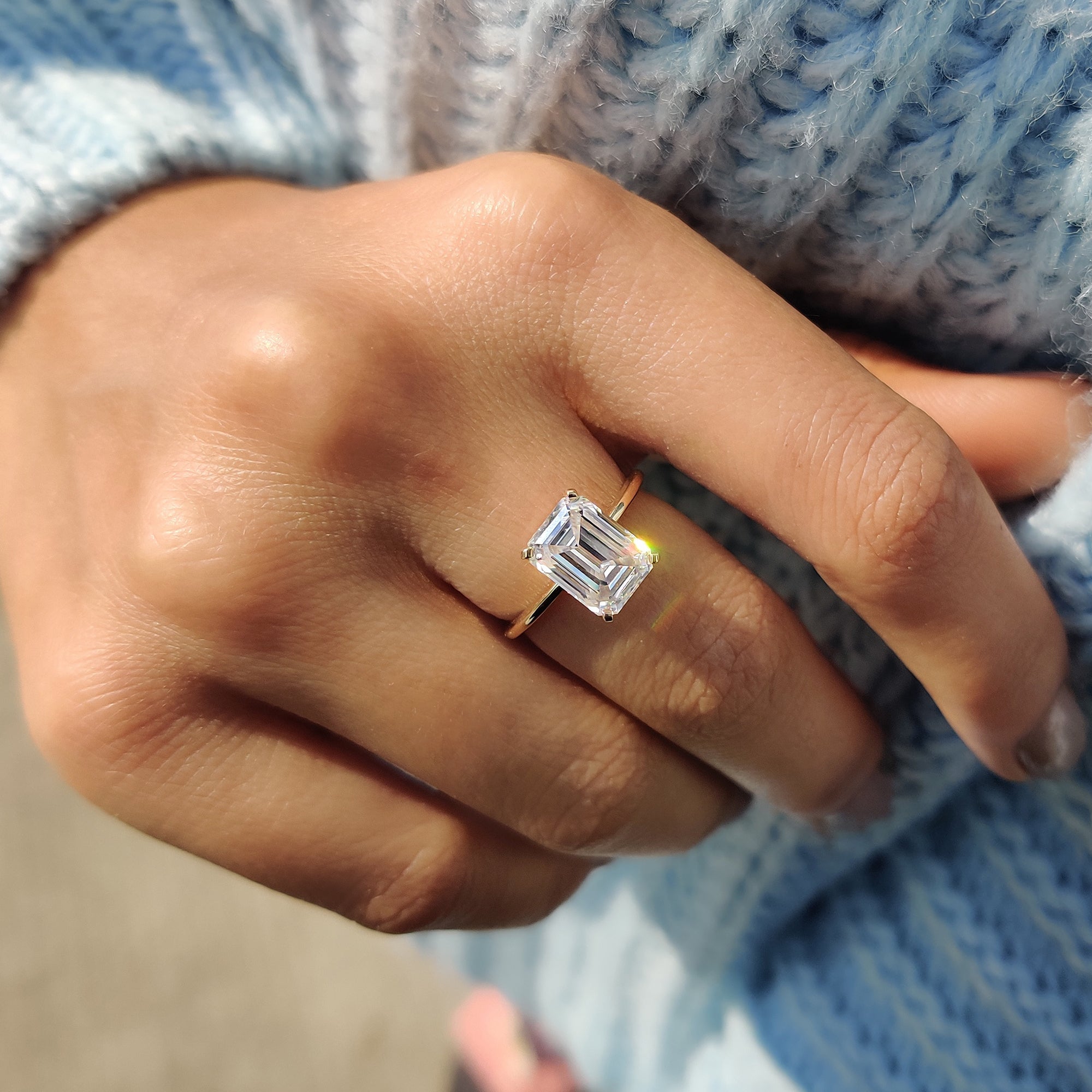 Solitaire moissanite ring crafted in knife edge style.
