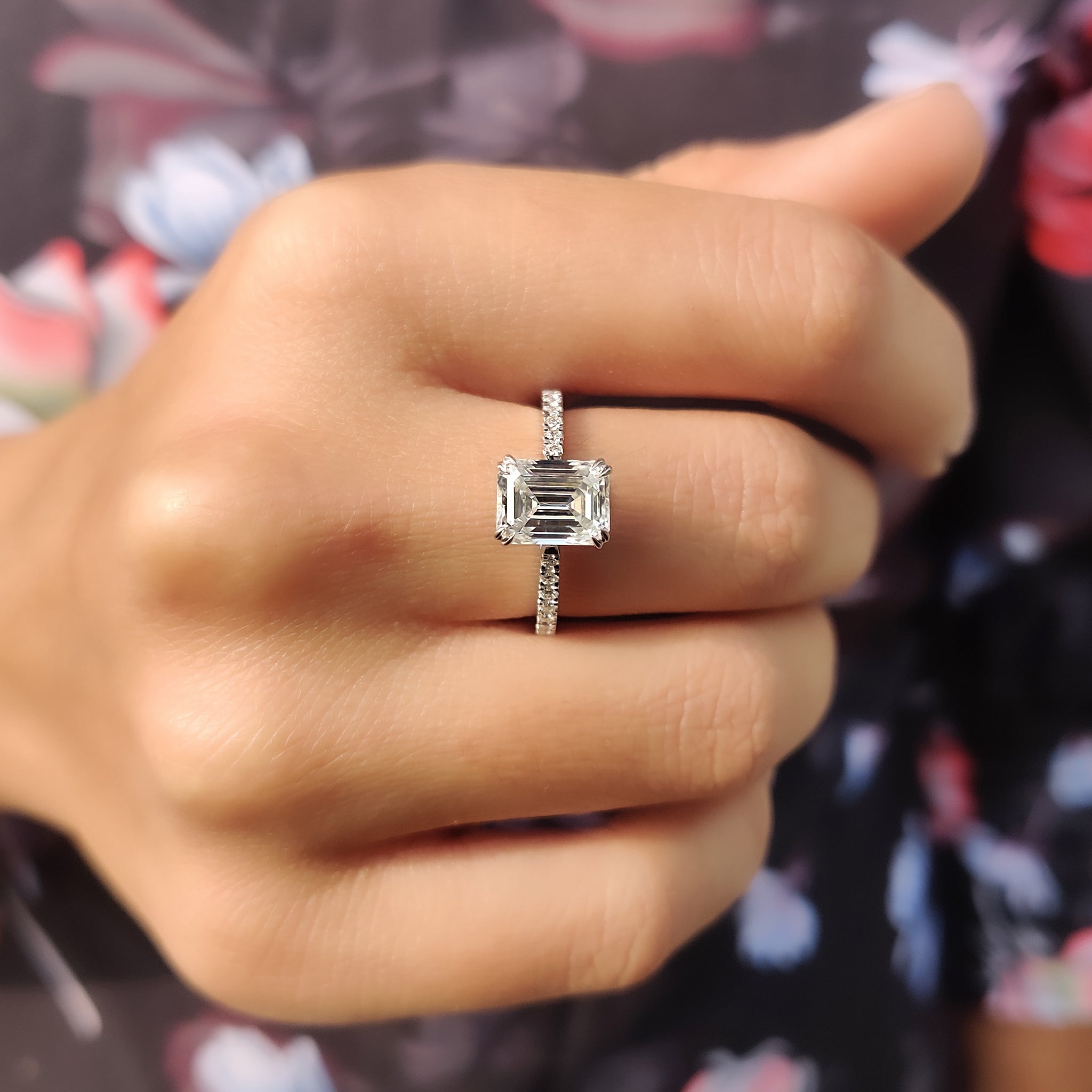 Pave setting moissanite ring with a double claw prong design.
