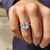 Cushion cut engagement ring with round cut halo setting.