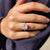 Handmade ring featuring a cushion cut engagement stone.