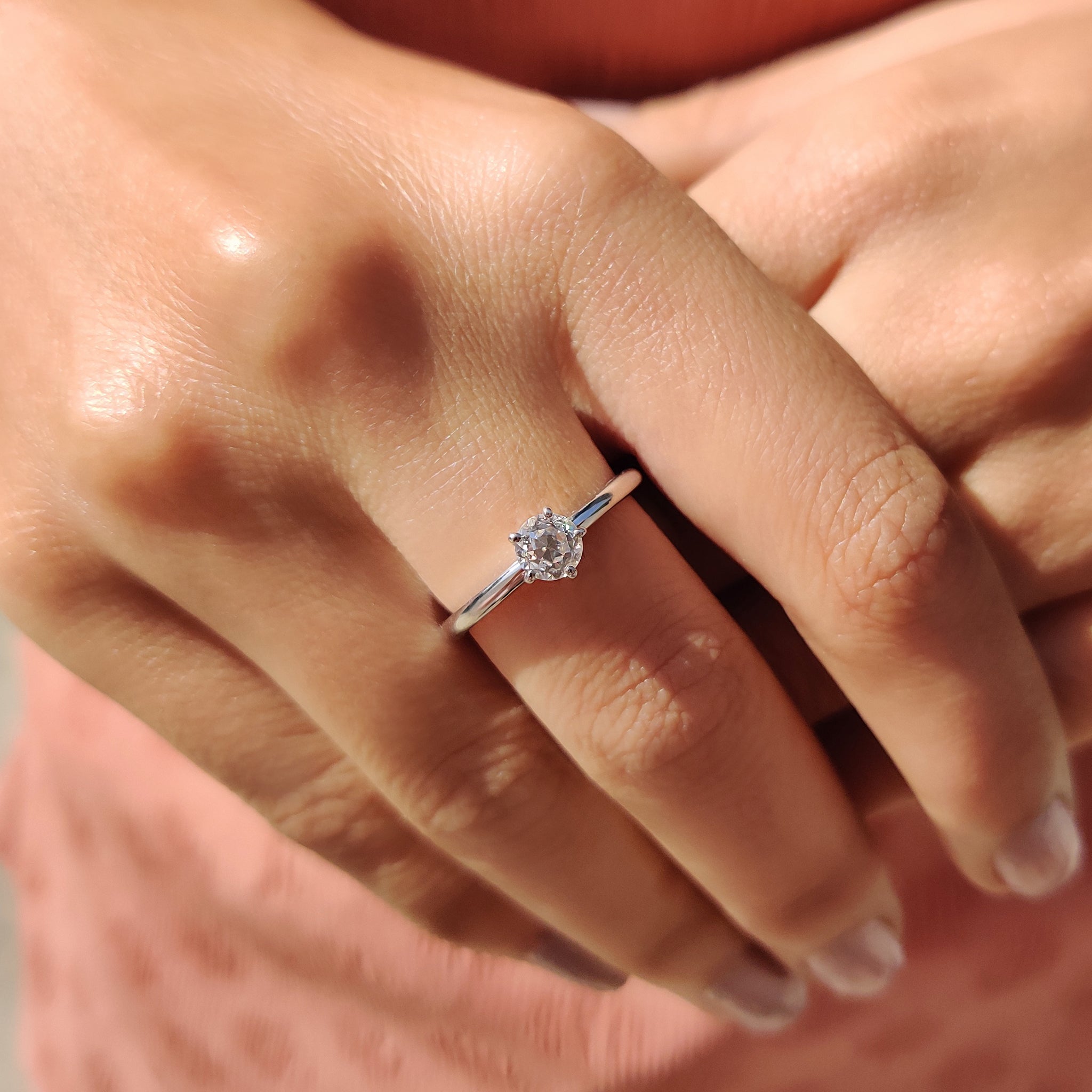 Unique engagement ring with a round old European cut stone.