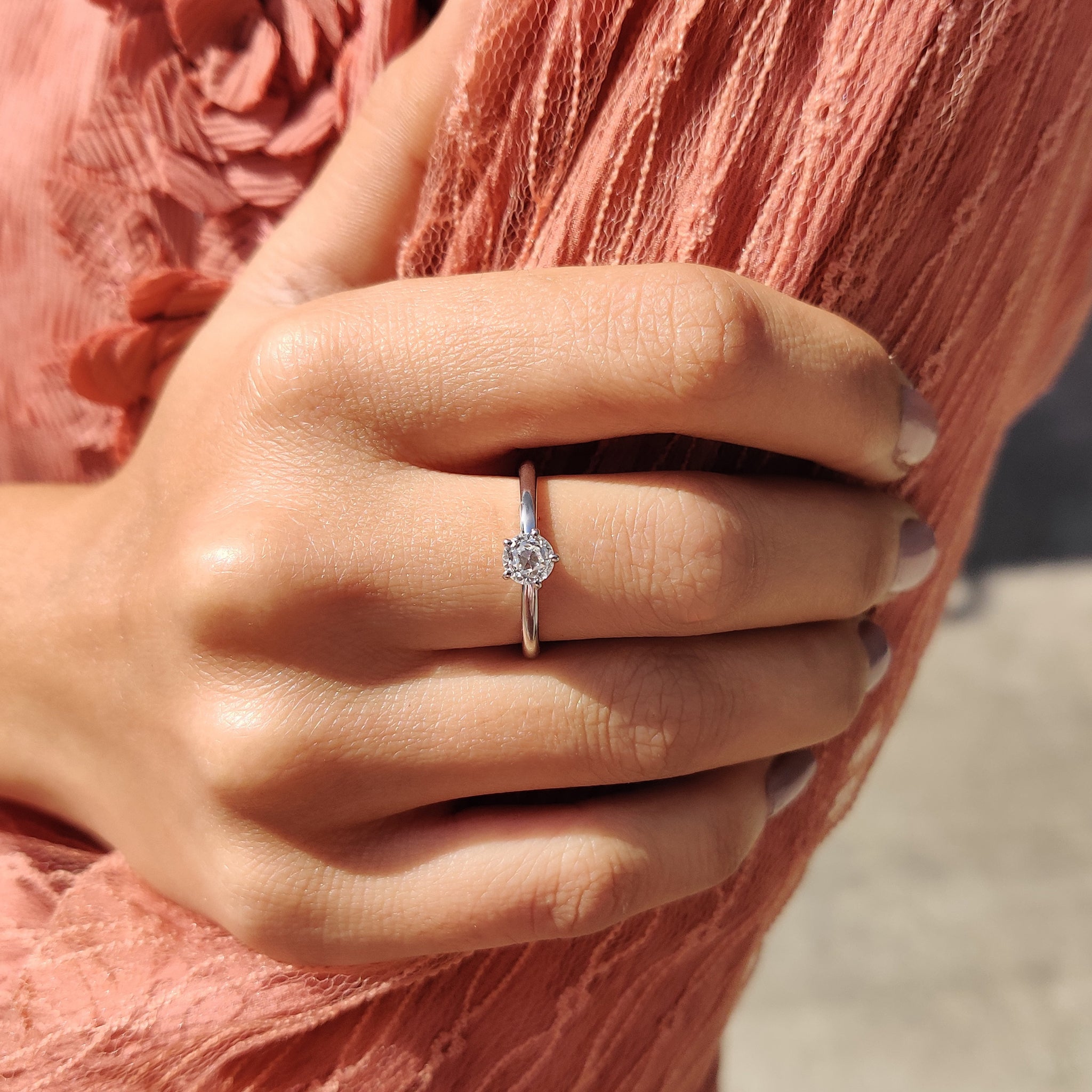 Handmade ring with a round cut and prong setting.