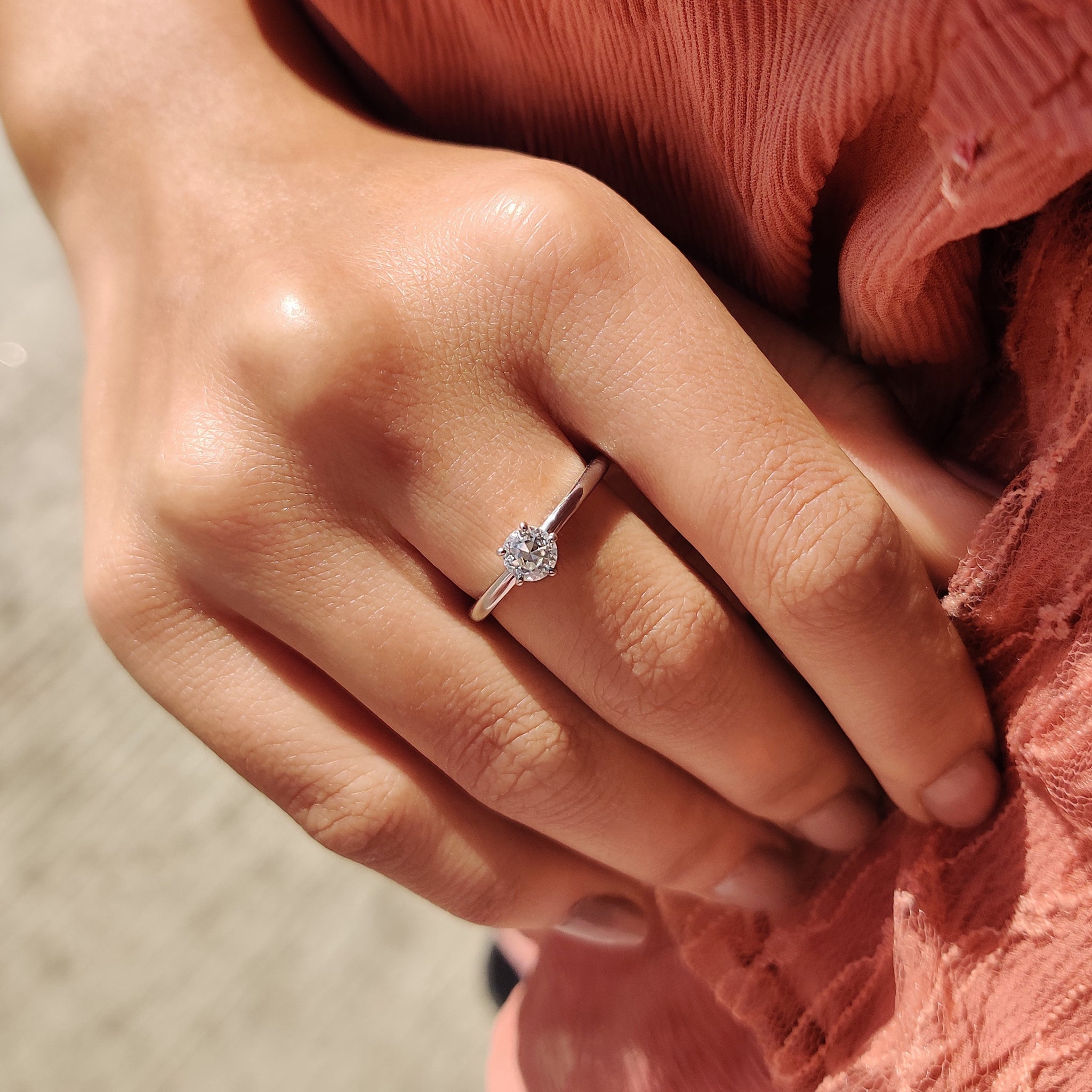 Handmade jewelry featuring a minimalist engagement ring design.