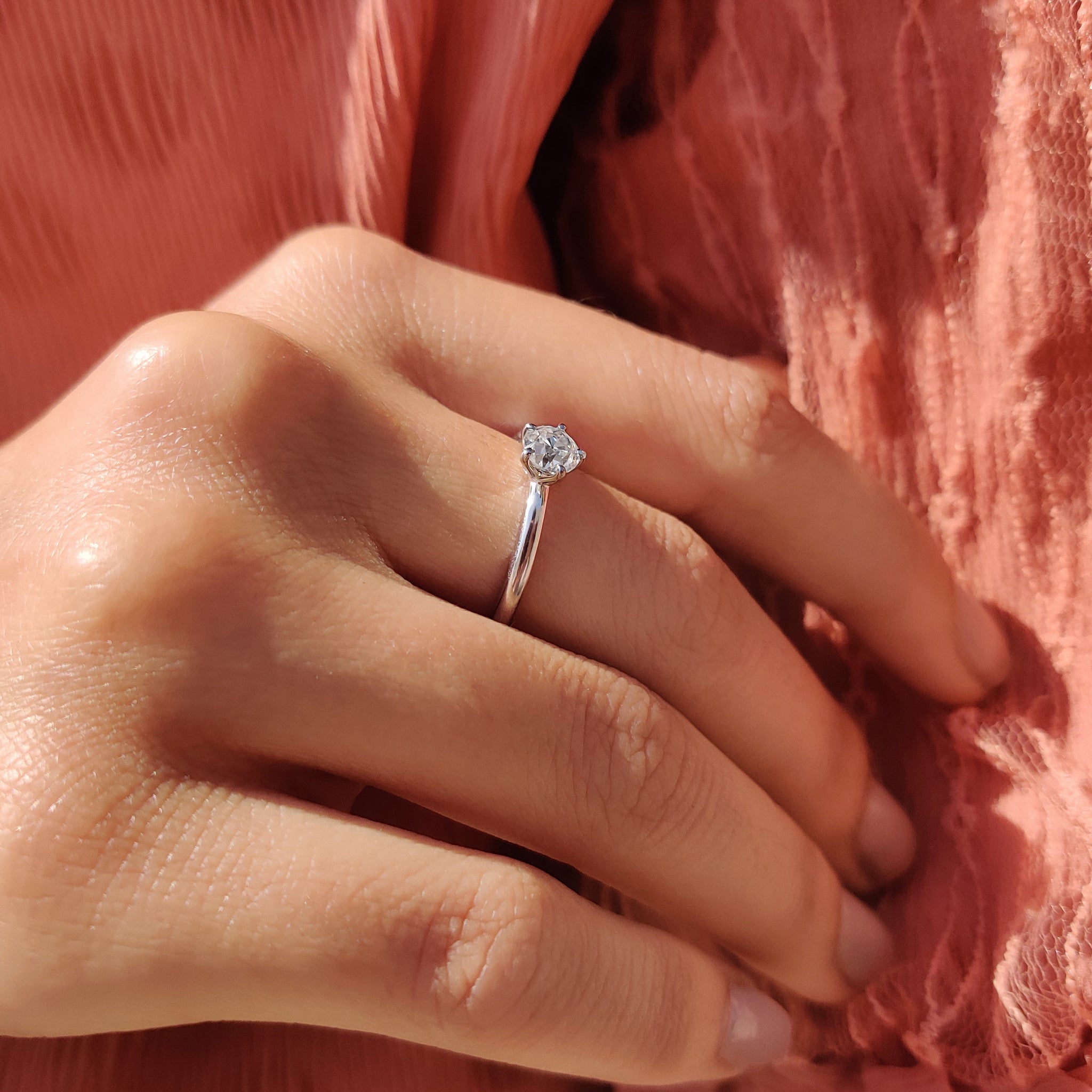 Carat diamonds ring with a round cut in a prong setting.