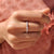 Twisted gold wedding band featuring a sleek and modern design.