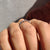 Twisted pave wedding band, combining pave setting with a stylish twist.