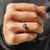 7 stone engagement ring with sparkle across the band.
