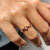 Yellow gold wedding band designed with a criss cross or zig zag structure.