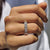 Prong set emerald cut band made of white gold, designed to shine from every angle.