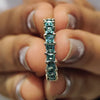 Sparkling moissanite wedding band photographed with natural light to show brilliance.