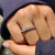 Moissanite wedding band in a handmade design with round and baguette stones.