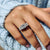 Princess cut ring displays clean modern lines.
