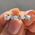 Marquise cut moissanite wedding band crafted with shared prong settings for a secure fit.