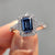 Emerald cut engagement ring with refined geometry
