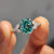 Oval side stone engagement ring with oval cut ring
