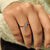 Round cut ring crafted in white gold.
