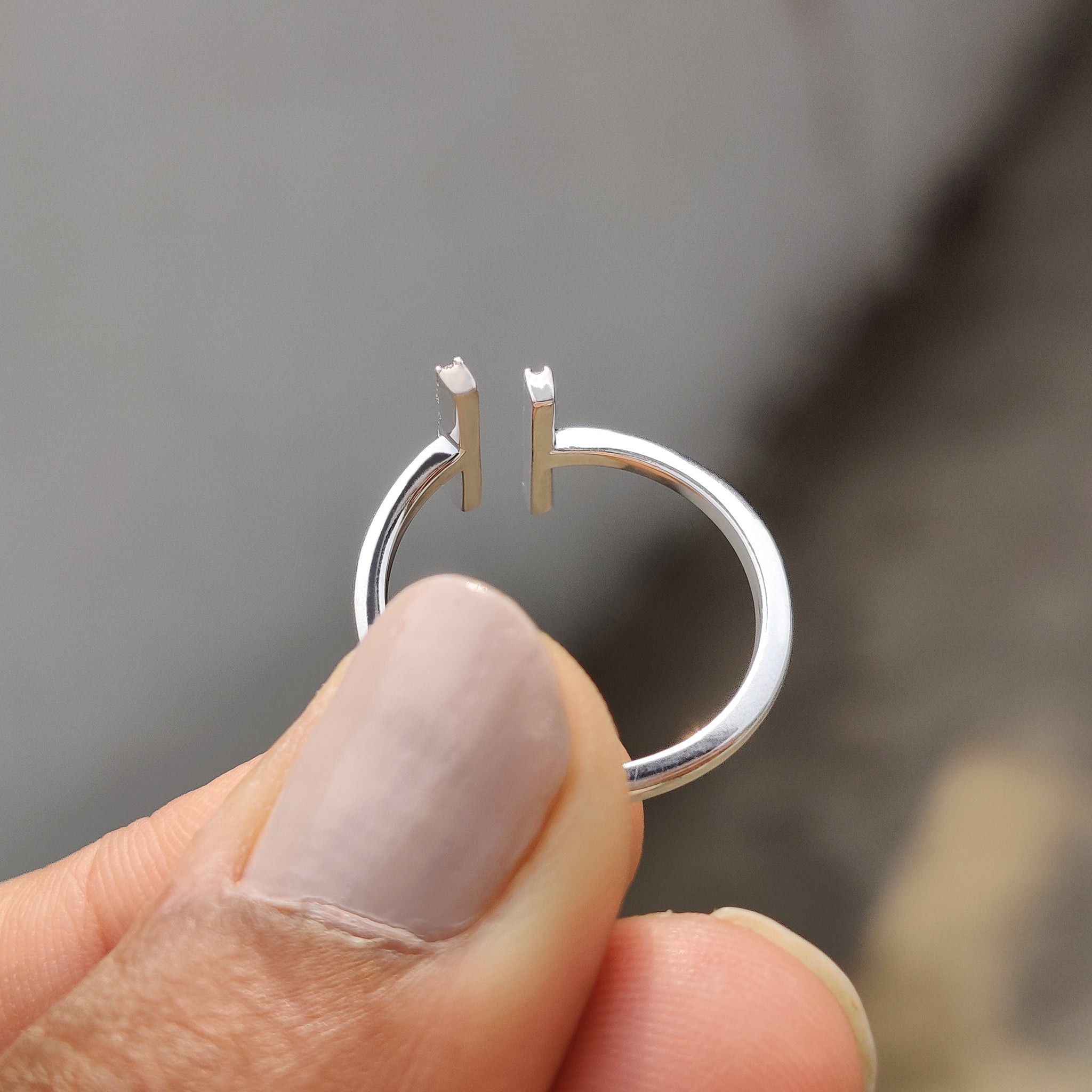 Gold proposal ring featuring a round cut moissanite.
