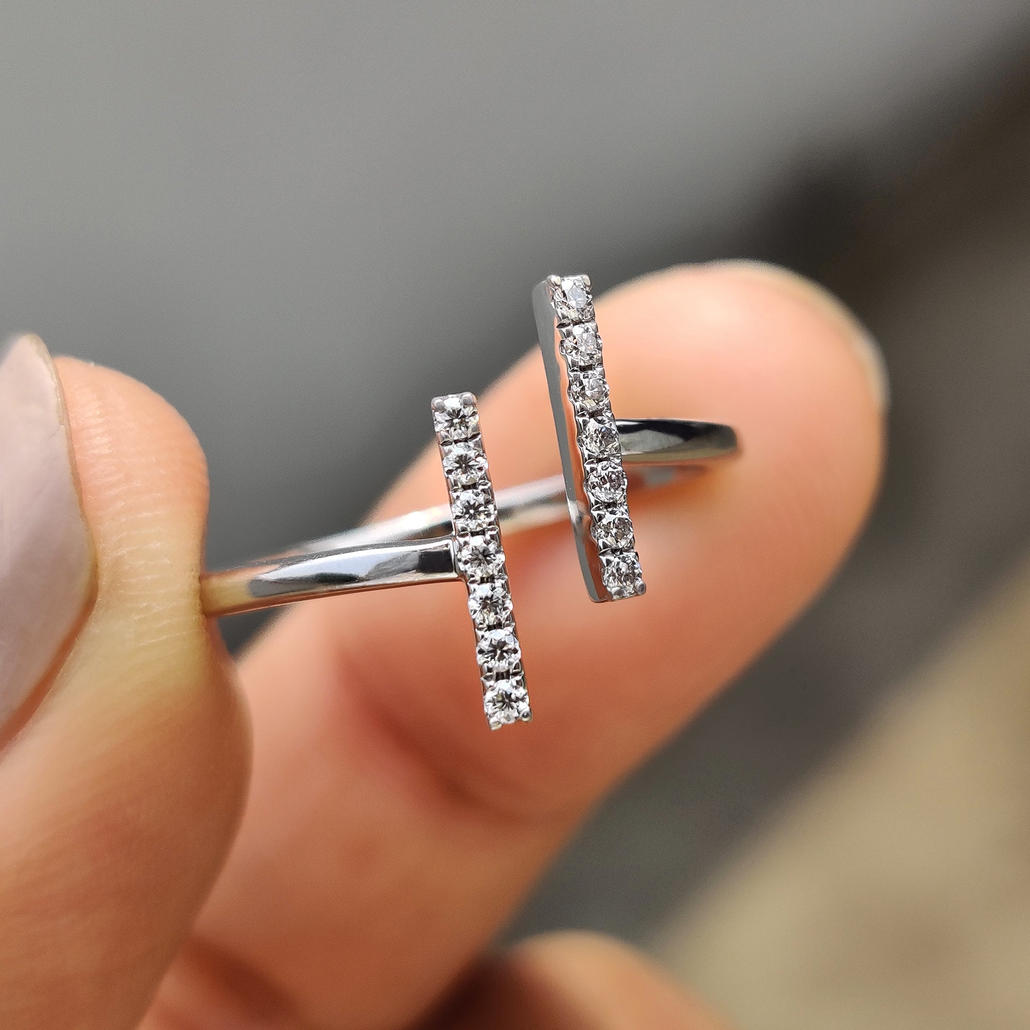Round cut moissanite ring designed with a simple band.
