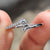 Open wedding band in white gold with a minimalist design, perfect for modern brides.