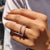 Custom tiara moissanite band featuring pear shaped stones in a v-style layout.