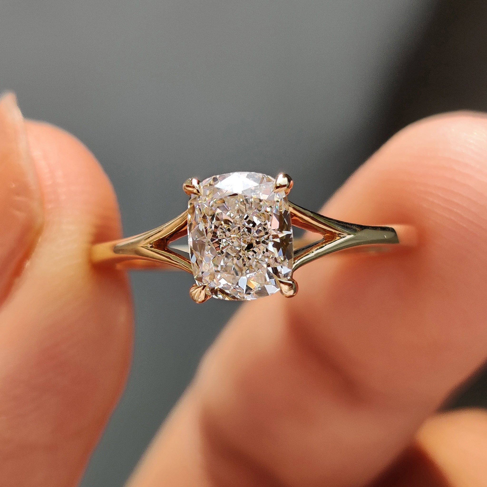 Elegant cushion diamond ring with a split shank band.
