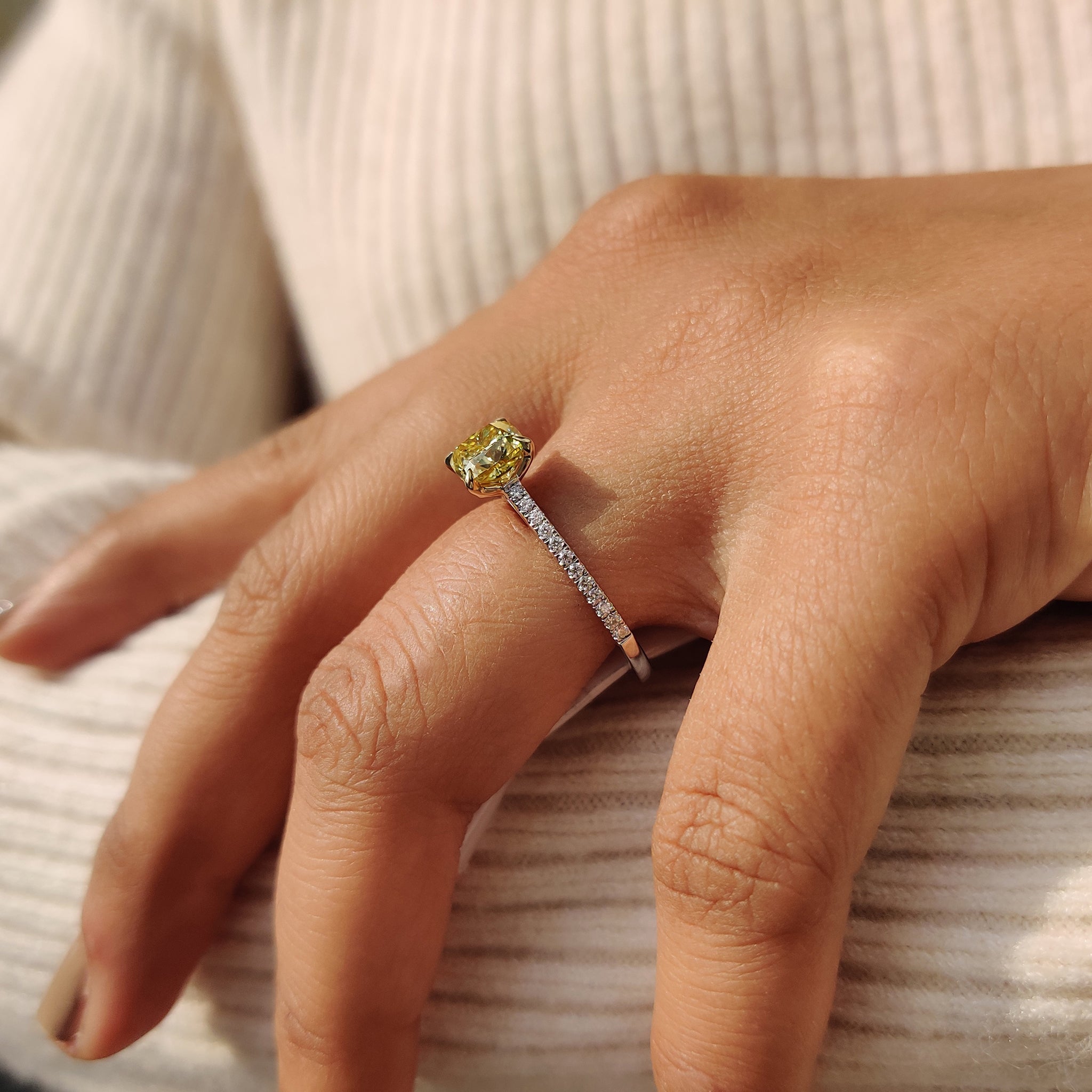 Best place to buy an engagement ring: A custom Moissanite pave ring with a cushion cut stone and yellow gold band.
