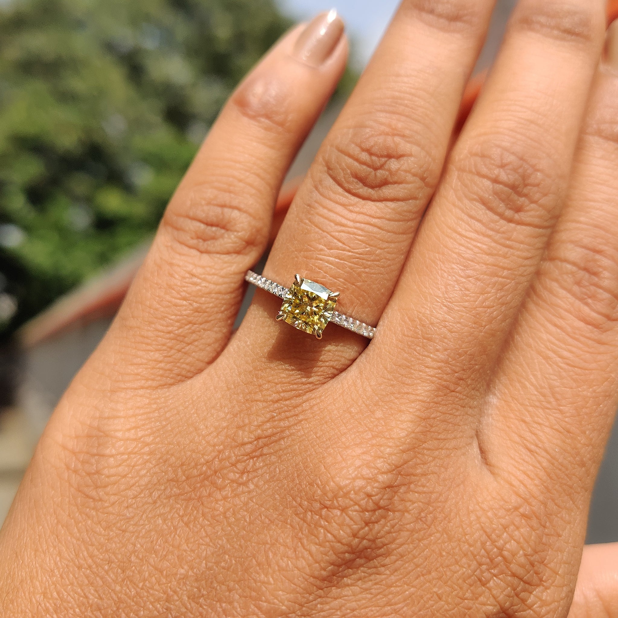 Unique engagement ring with a cushion cut Moissanite stone set in a claw prong setting, perfect for any proposal.
