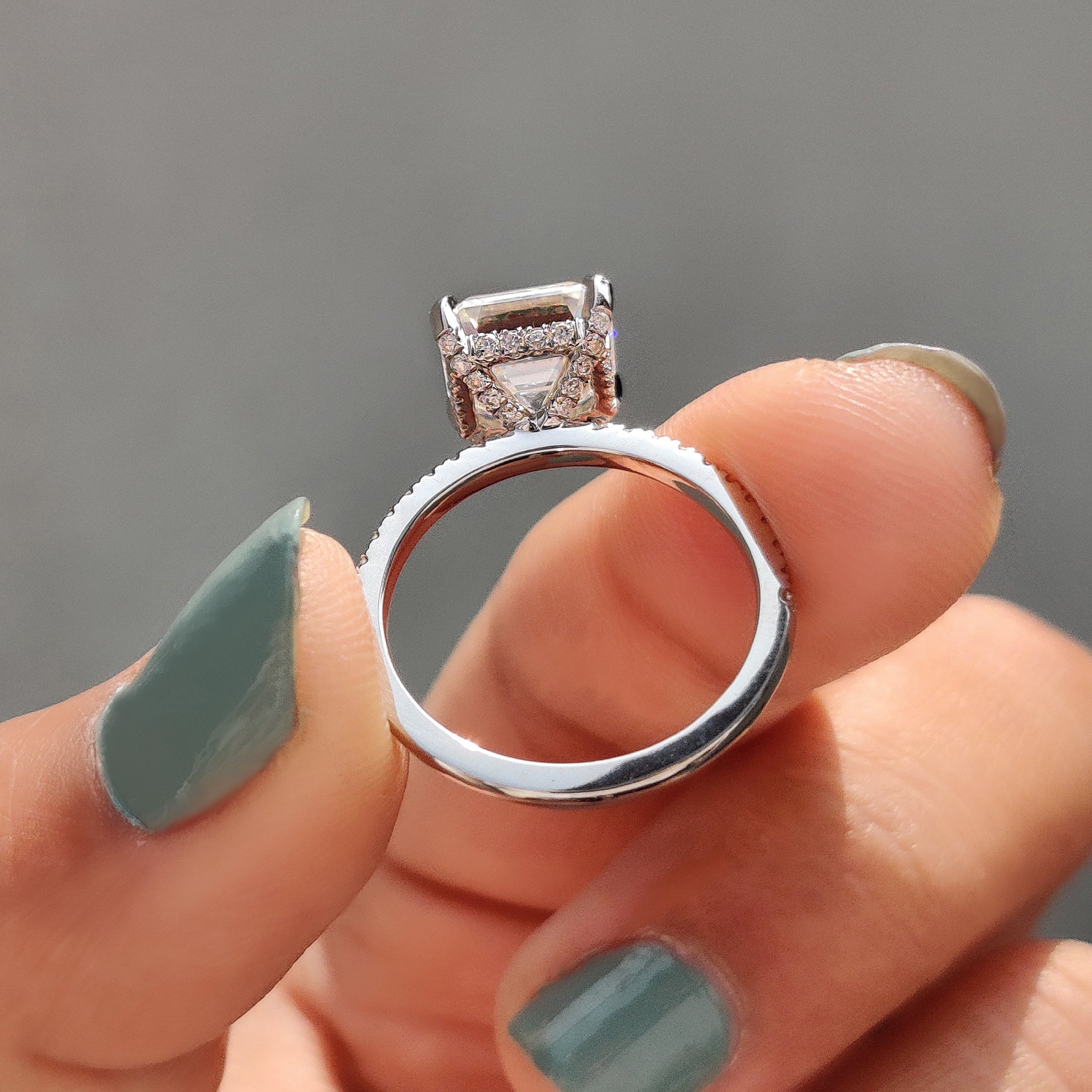 Custom engagement ring in white gold with halo.
