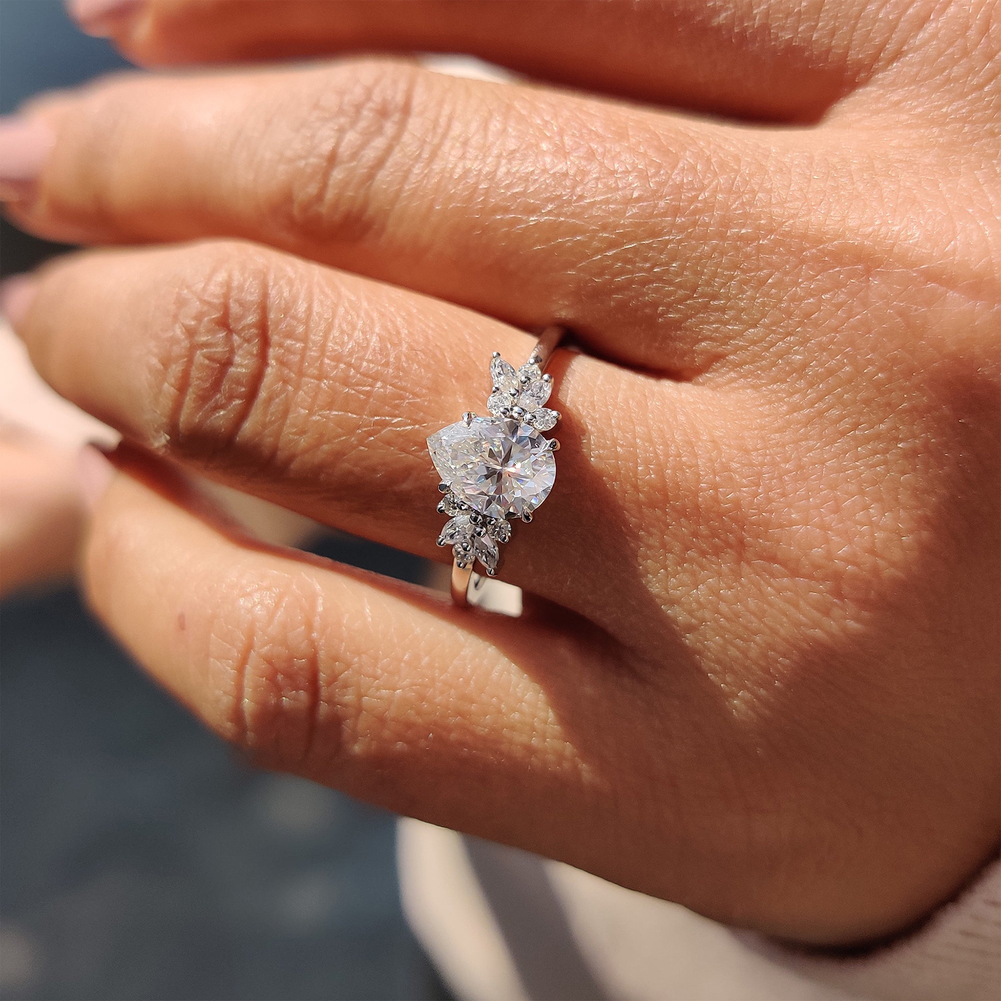 Handmade white gold engagement ring with pear Moissanite