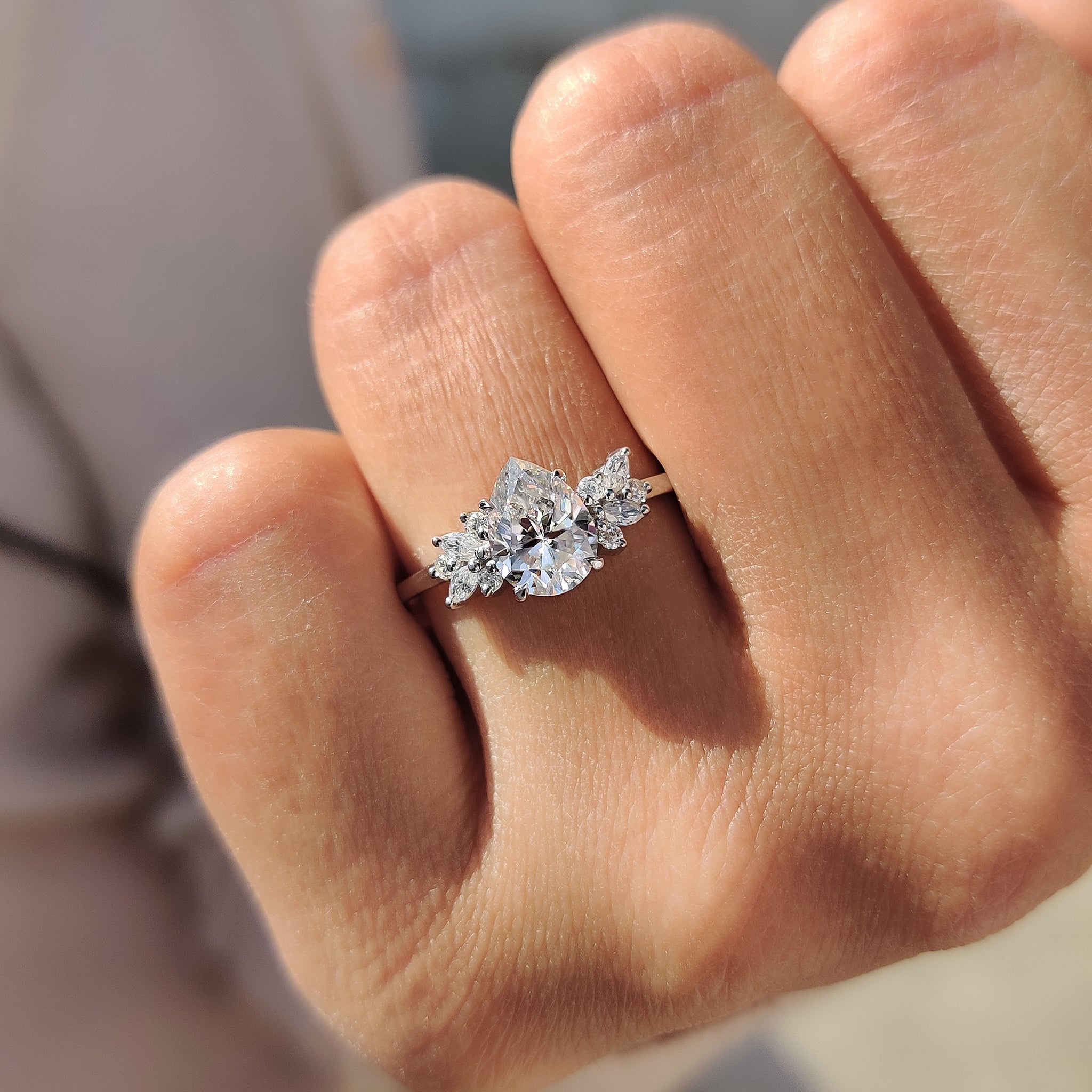 Elegant white gold engagement ring with pear Moissanite