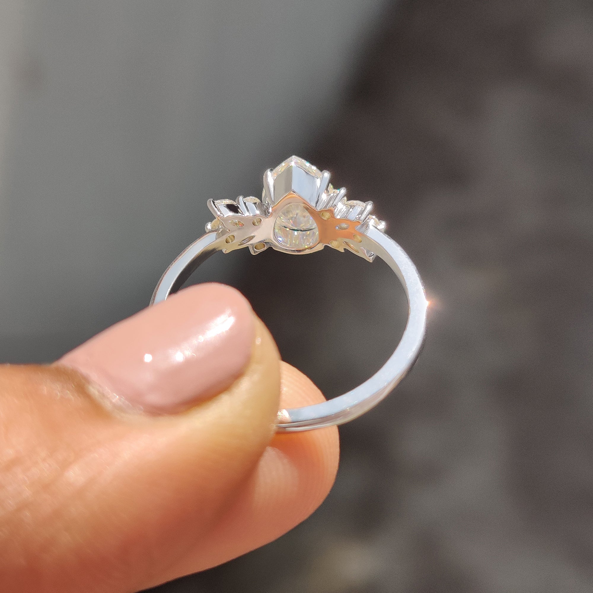 Marquise and round cut side stones on Moissanite pear ring