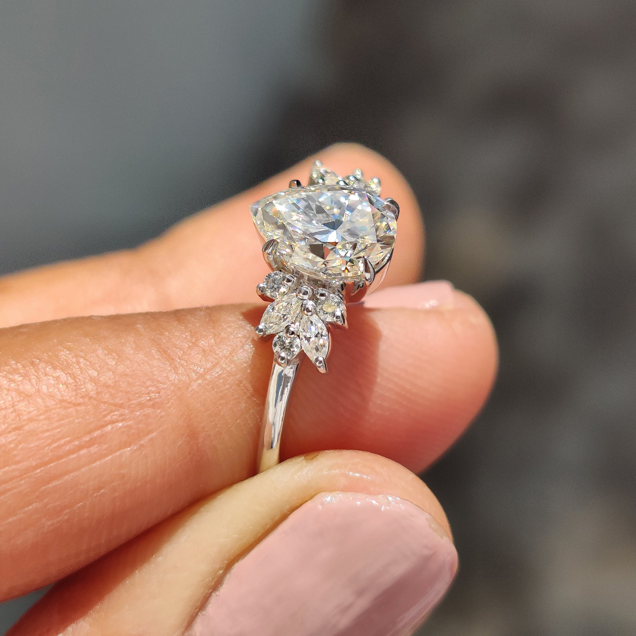 Custom Moissanite pear ring with 4 claw prong setting
