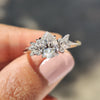 Moissanite pear ring with marquise and round cut side stones