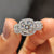 Round cut moissanite shines on white gold ring.
