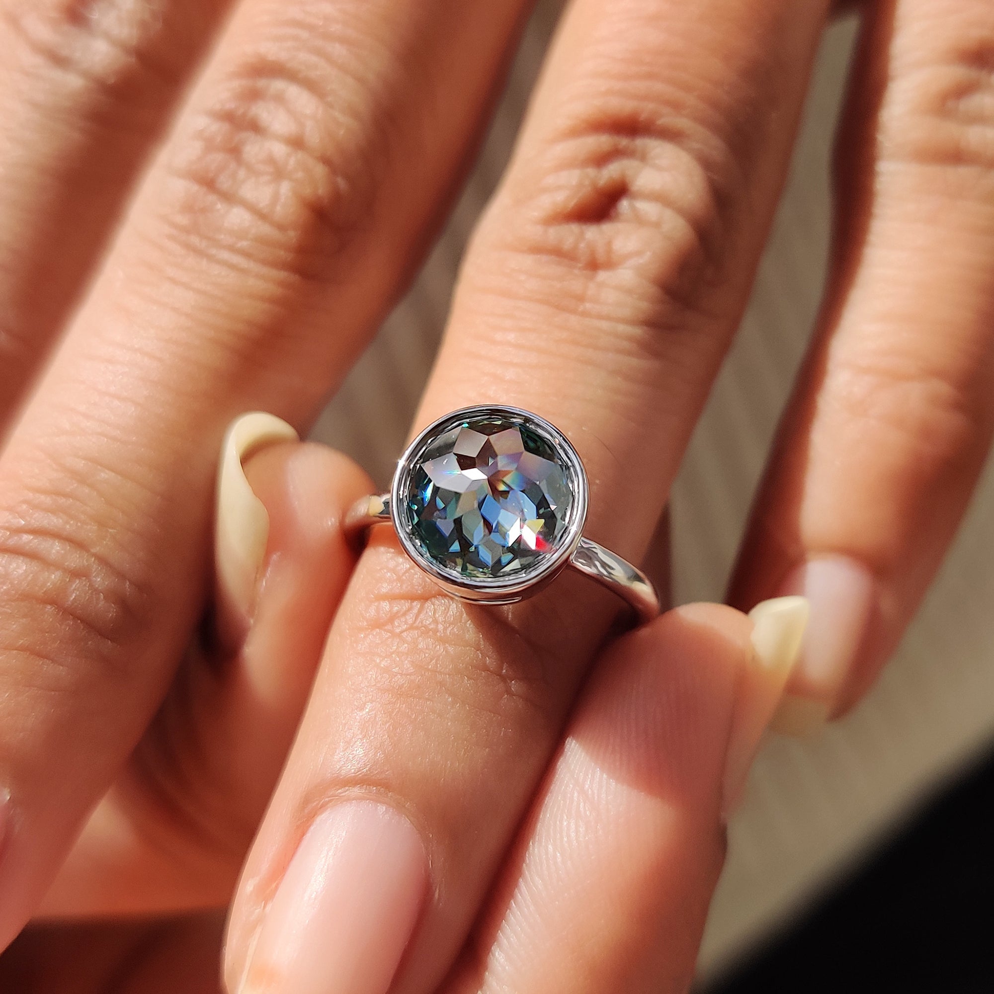 Best place to buy an engagement ring featuring a green rose cut Moissanite in white gold.
