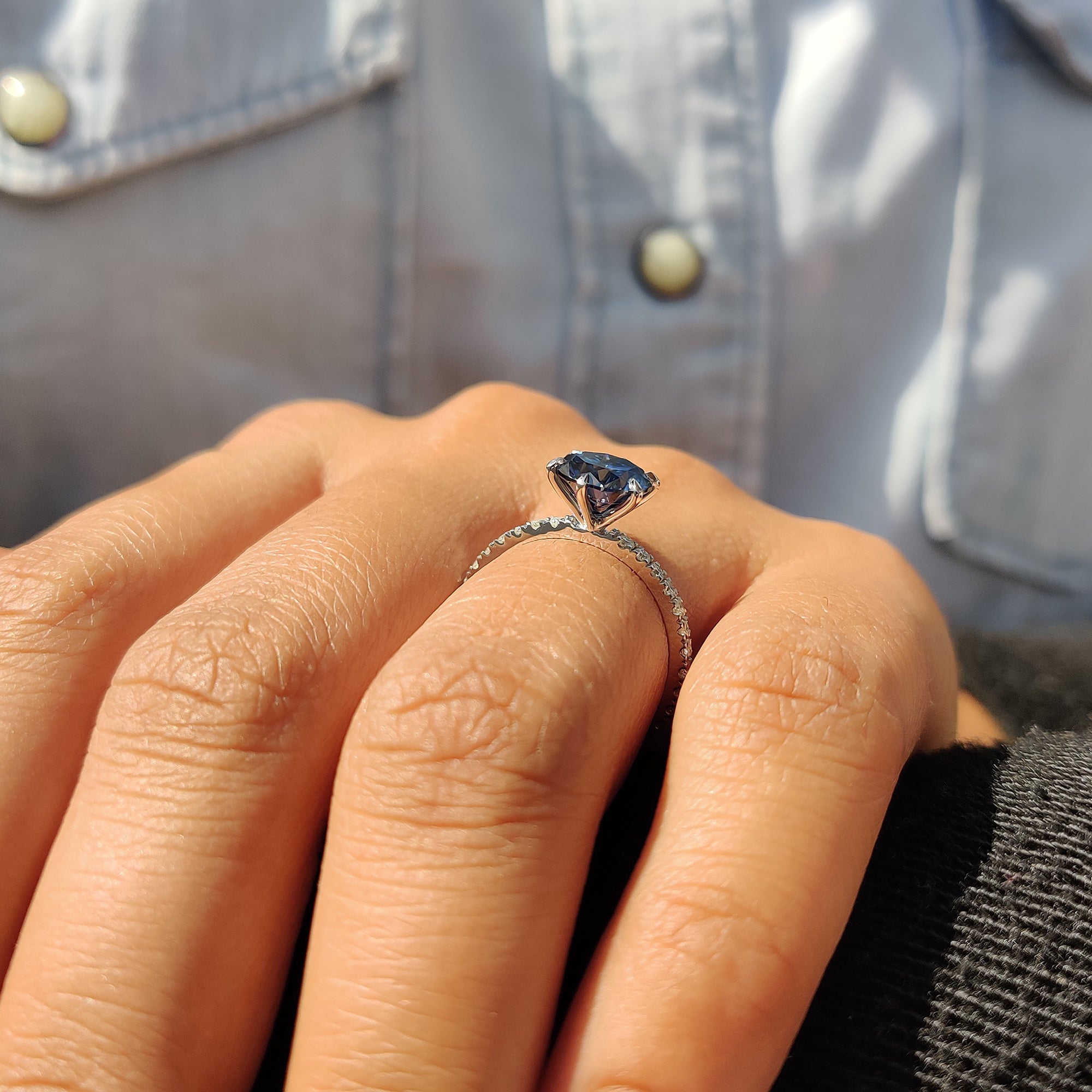 Best place to buy an engagement ring featuring a royal dark blue round cut Moissanite in a pave setting.
